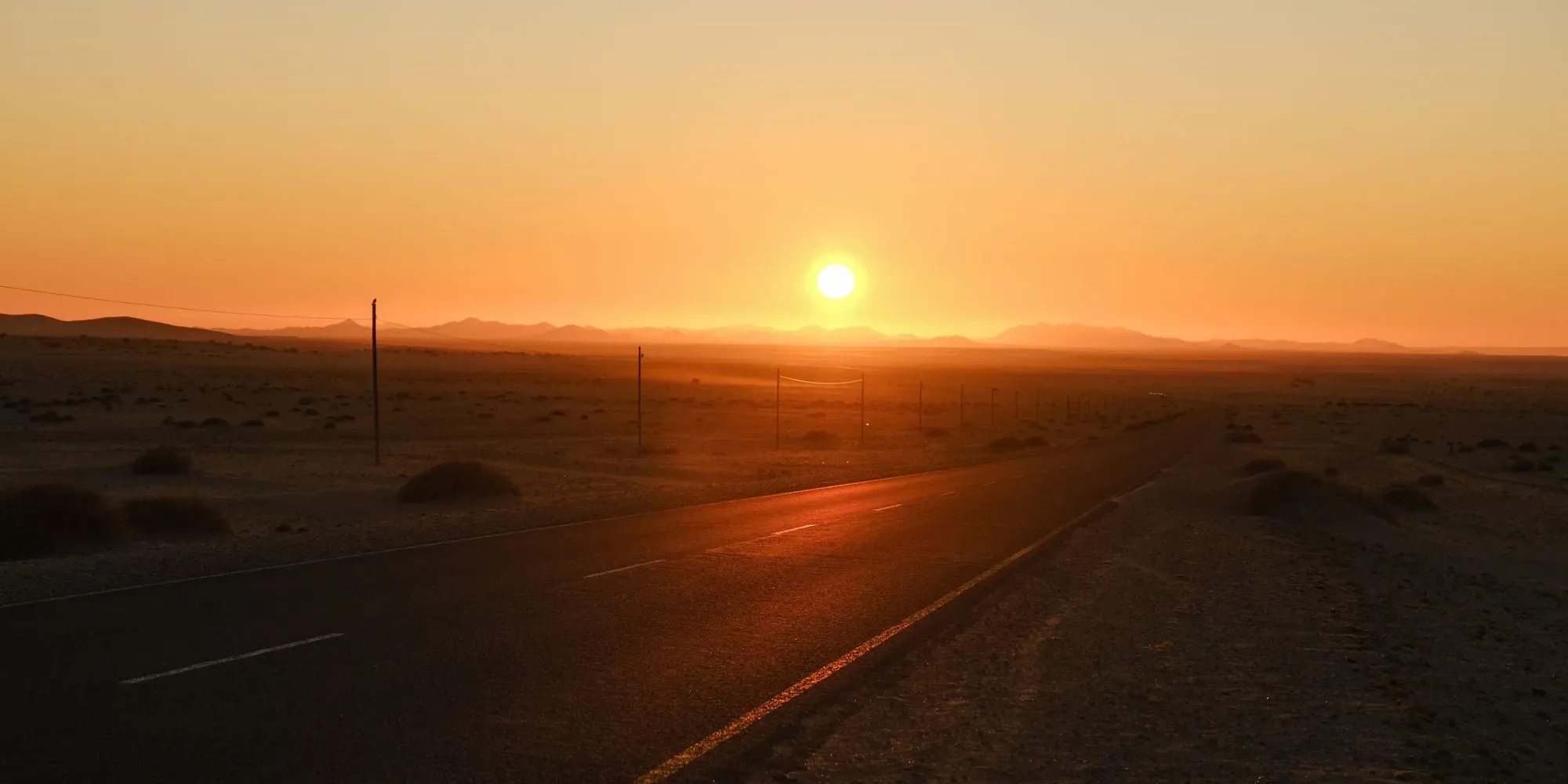 A desert road at sunset